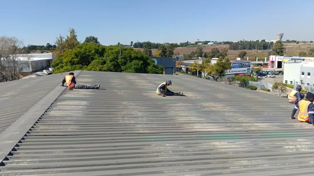 Anderson Concepts crew working on an industrial roof