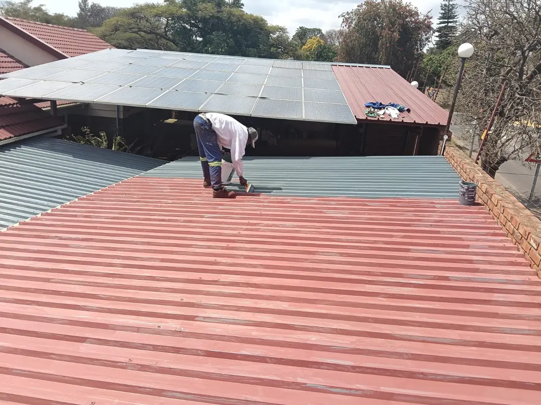 Anderson Concepts team recoating a roof